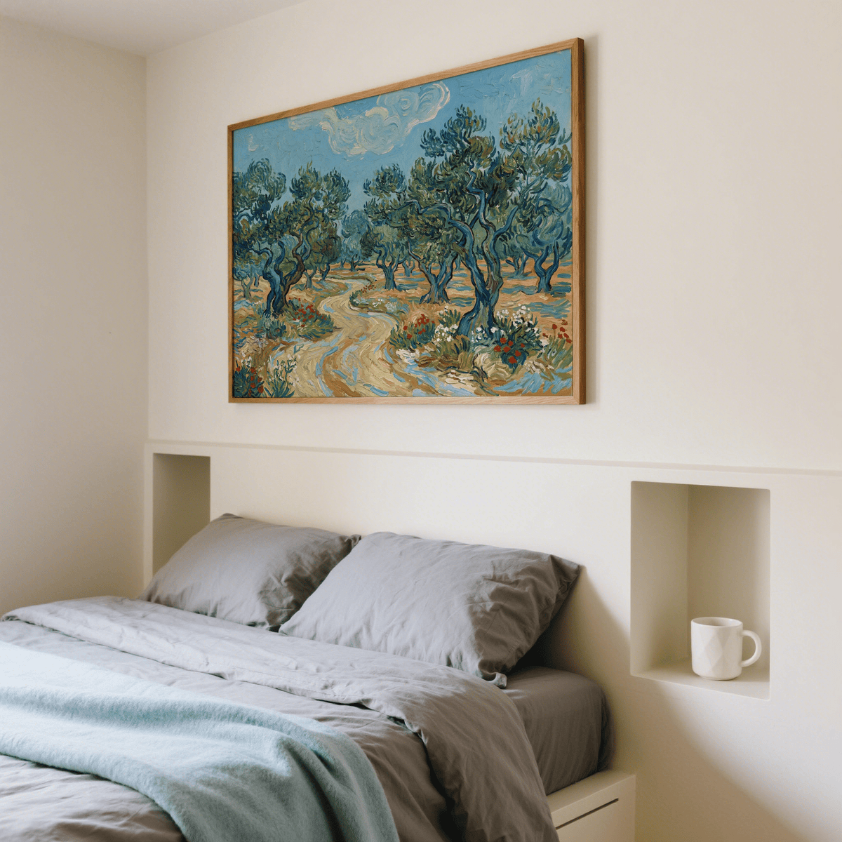 Olive Tree Landscape Print framed print of olive trees in blue and green tones above a bed with grey bedding