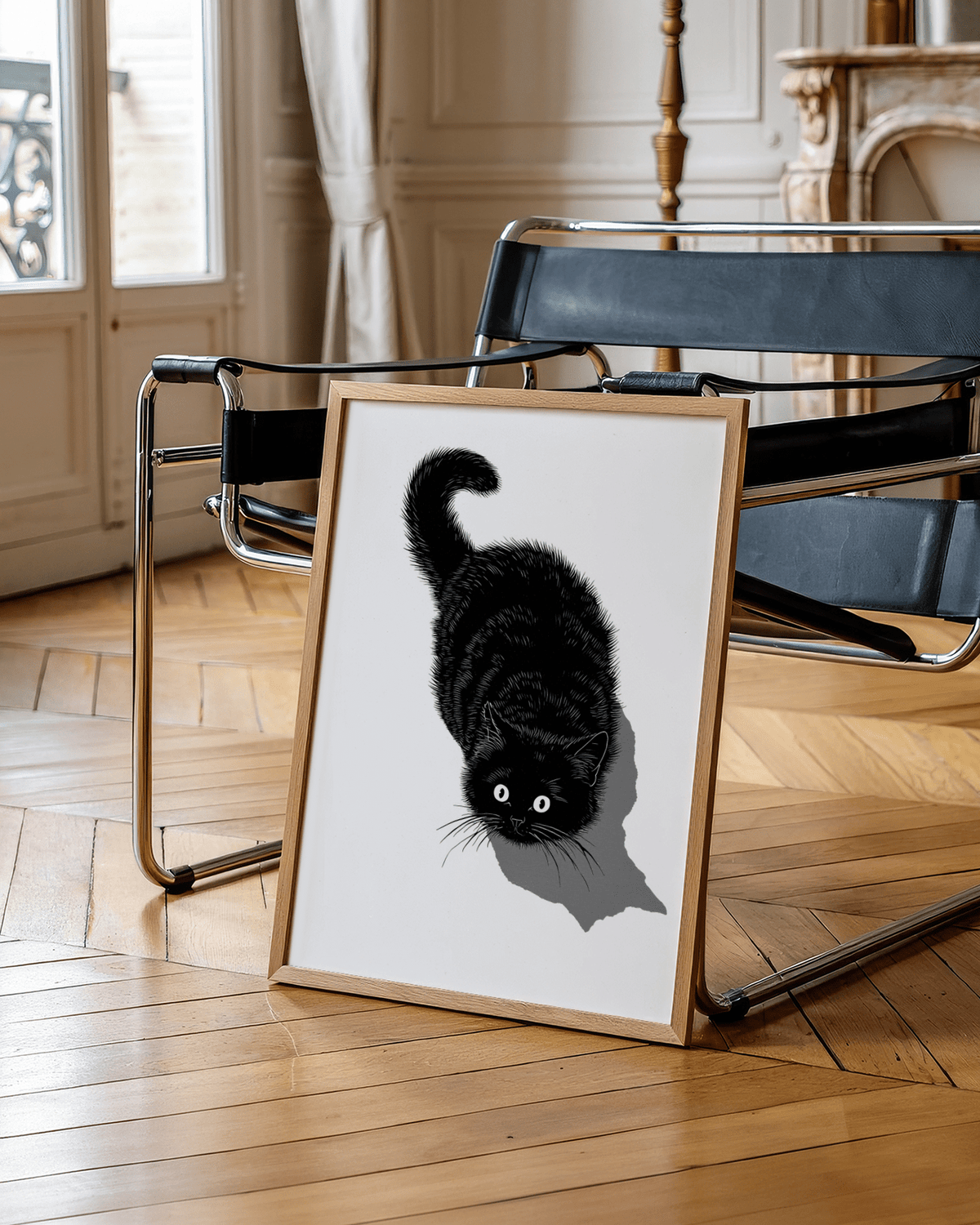 Black Cat Print leaning on a chair with black seat in a room with parquet flooring and a marble fireplace