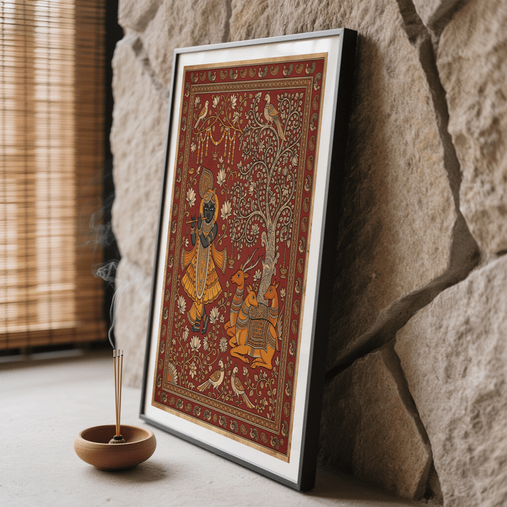 Framed Indian Folk Art Print showing krishna playing flute in orange and brown tones next to incense burner