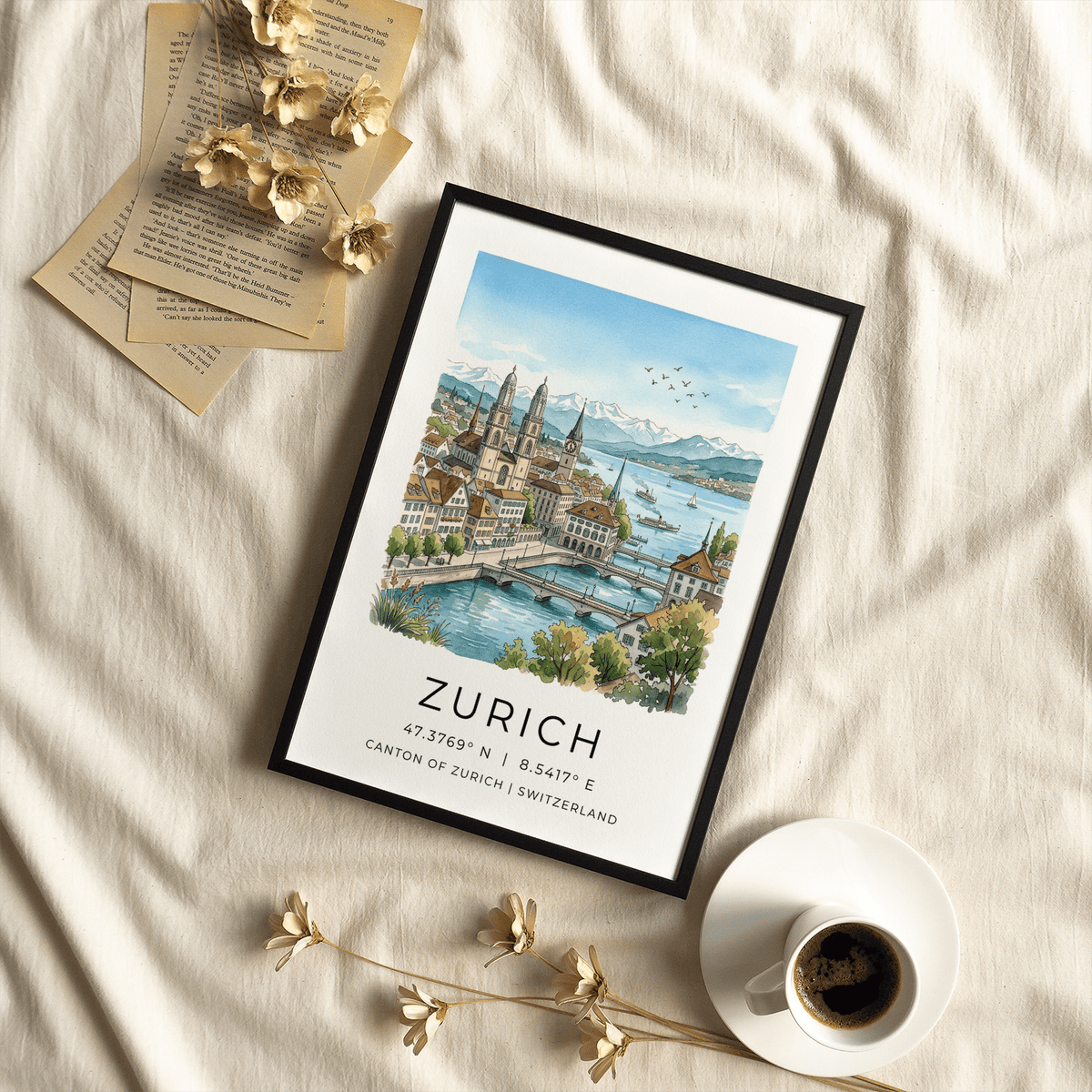Framed Zurich City Art Print leaning on a fabric surface with dried flowers and a cup of coffee nearby