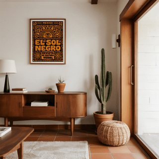 Mexican Culture Art Print wall art with sun and eye symbol in orange and black in a living room with cactus