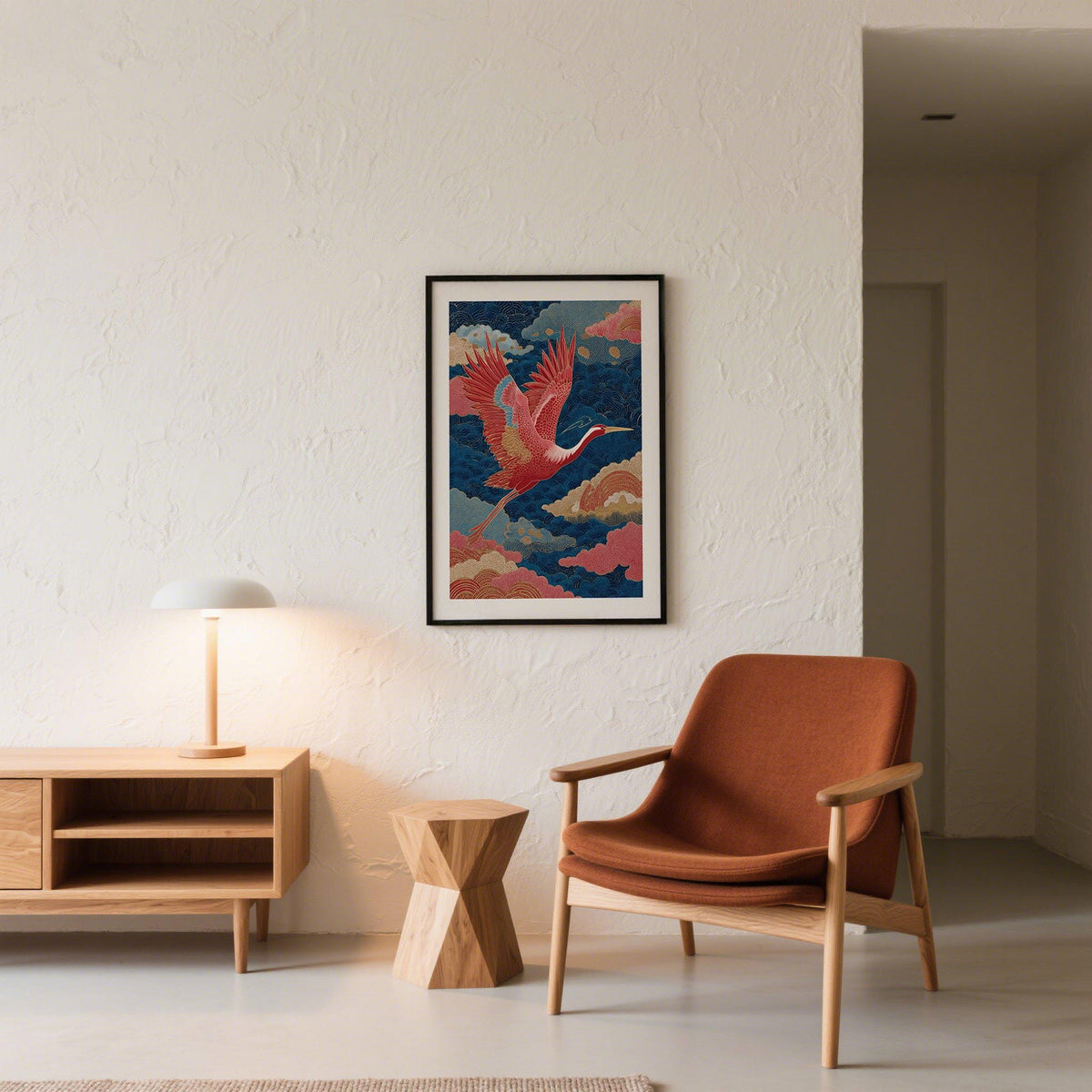 Vintage Japanese Print wall art of a red crane flying amid blue and pink clouds in a lounge with orange armchair