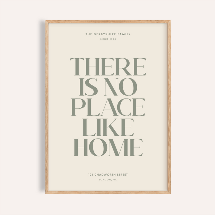 No Place Like Home Print with green typography on a cream background in a wooden frame