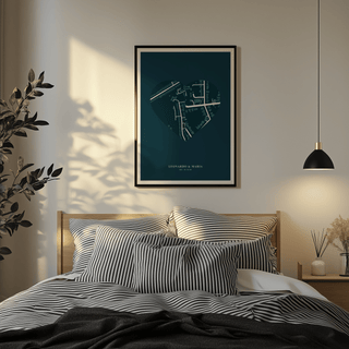 Print on a wall in a bedroom of a heart-shaped map in dark blue and teal above a bed with striped pillows