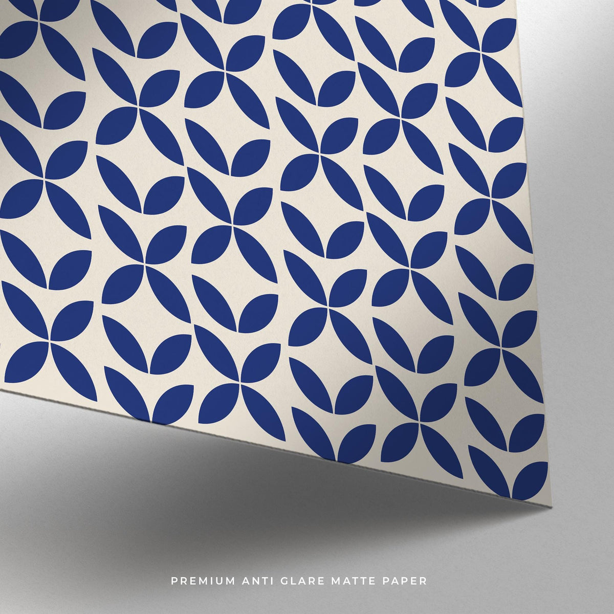 Close-up of simple wall art with a blue geometric pattern on cream matte paper