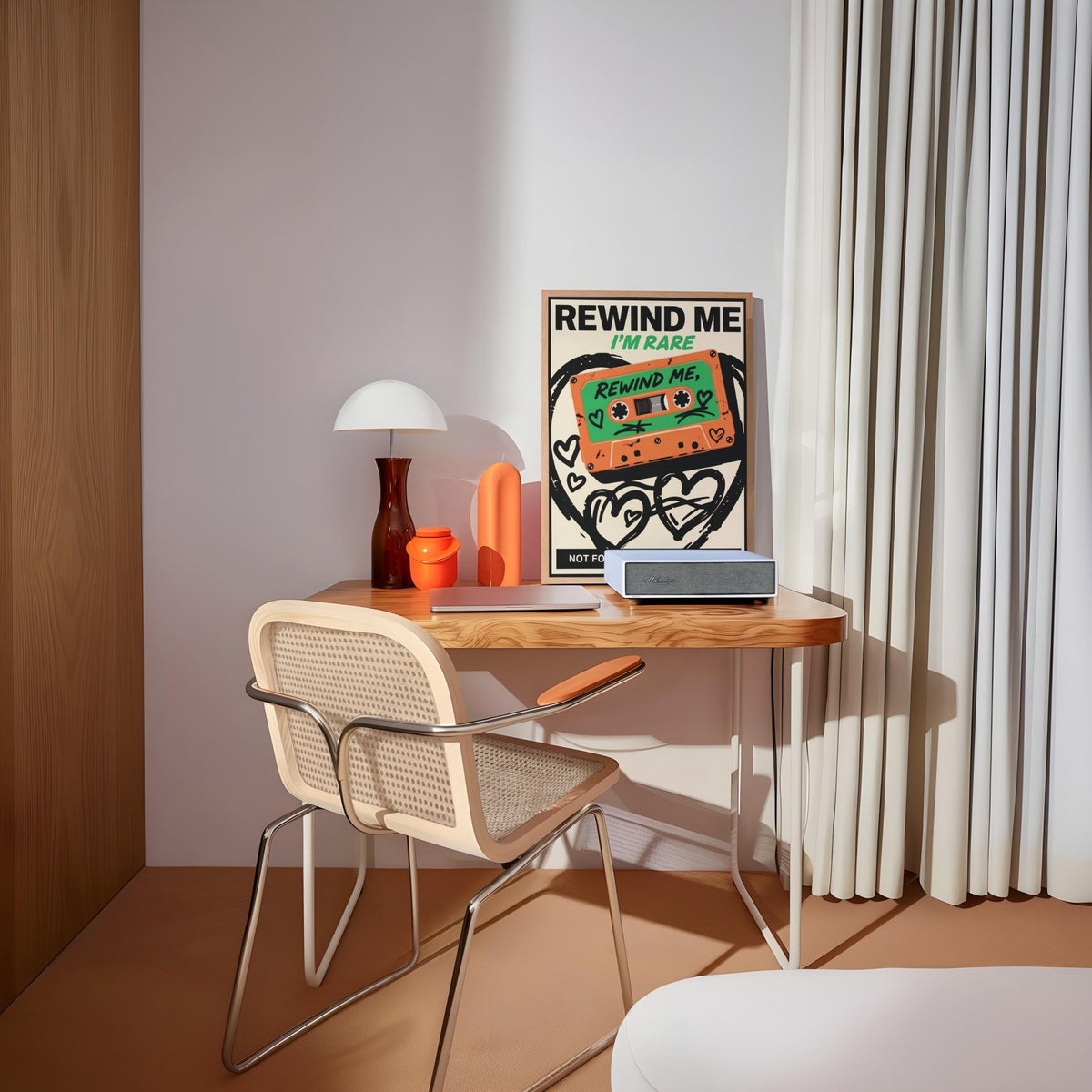 Retro cassette wall art leaning on a desk with a table lamp in a bright room