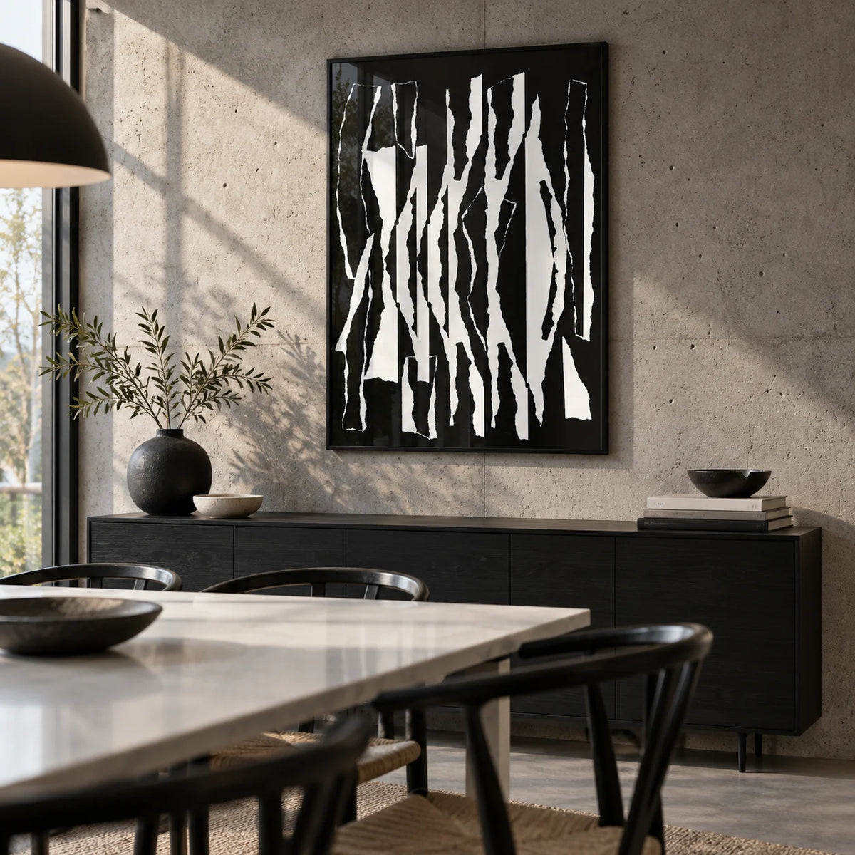 Abstract Black And White, framed on the wall of a modern dining room with a concrete wall