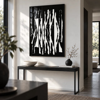 Abstract Black And White, framed on the wall of a modern monochrome hallway with a white wall