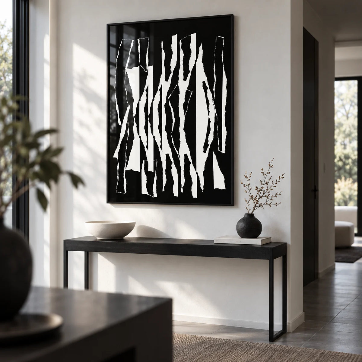 Abstract Black And White, framed on the wall of a modern monochrome hallway with a white wall
