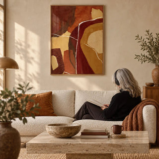 Abstract Earth Tones Print, framed on the wall of a warm earthy living room with a cream limewashed wall