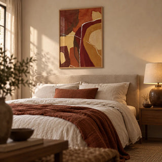 Abstract Earth Tones Print, framed on the wall of a warm minimal bedroom with an oat linen headboard