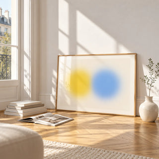 Abstract Minimal Print, framed and leaning on the parquet floor of a bright living room