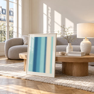 Abstract Stripe Print, framed and leaning against a coffee table in a bright living room