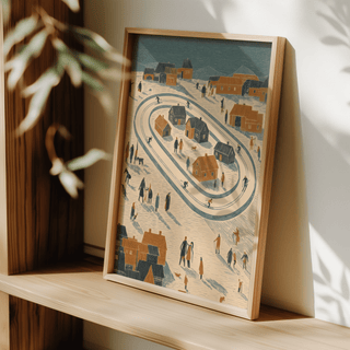Framed Winter Village Art Print leaning on a wooden shelf with shadows and blurred plant