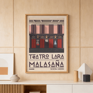Framed Teatro Lara wall art with red doors and decorative facade leaning on a wooden shelf