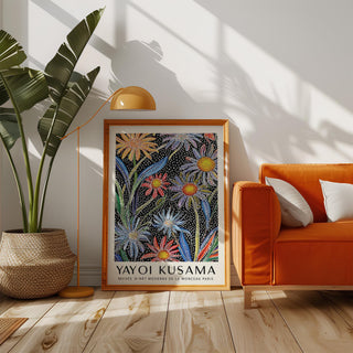 Floral Pop Art print leaning by orange sofa and plant in a sunlit living room