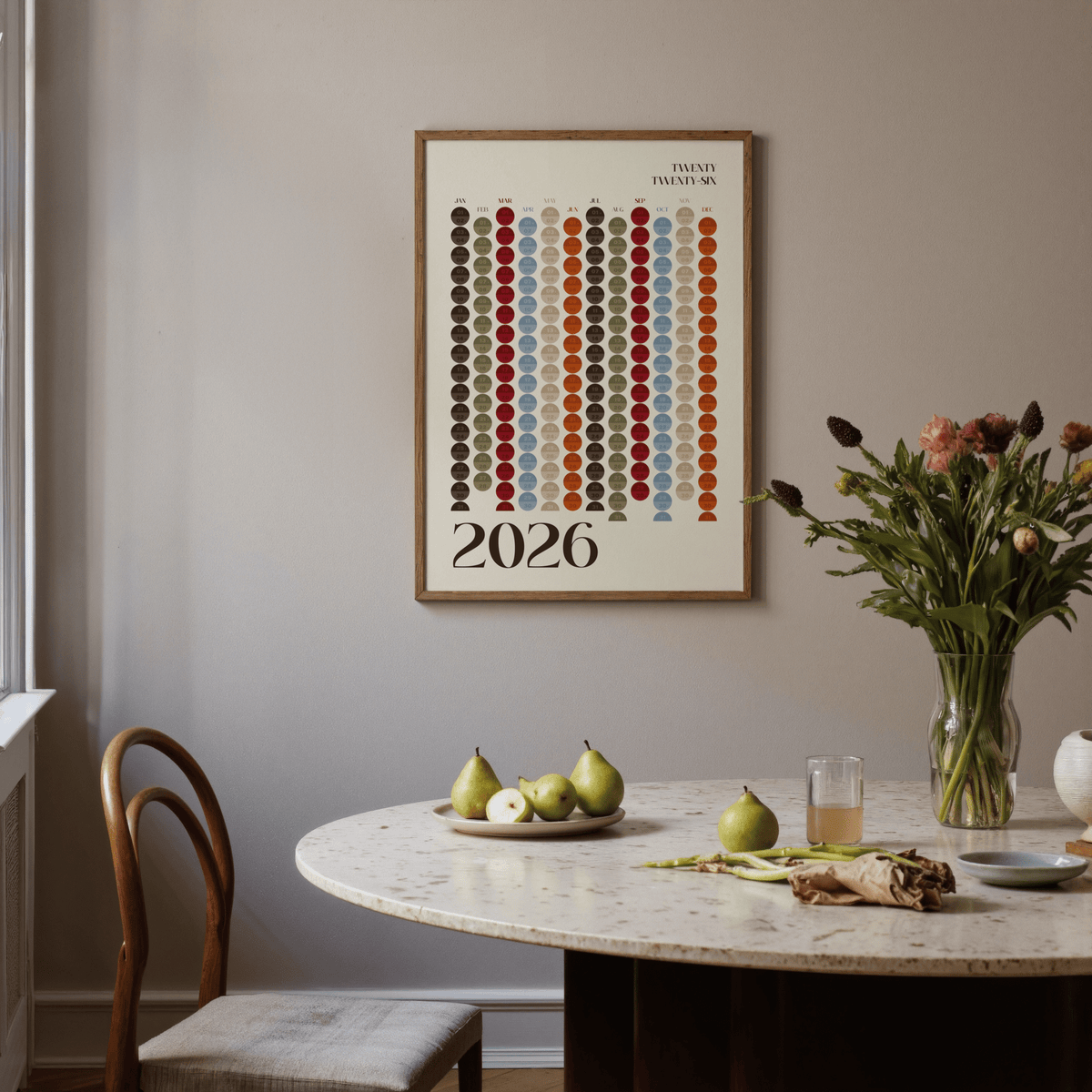 Big Calendar for Wall hanging above a marble dining table with pears and a flower vase