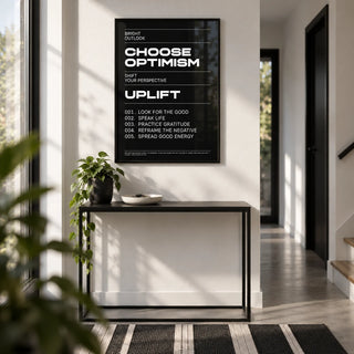Affirmation Print, framed on the wall of a modern monochrome hallway with a white wall and a black and white floor runner