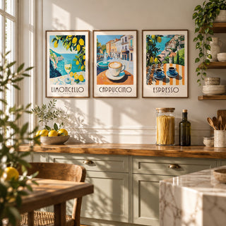 Amalfi Coast Prints Set of 3 styled on a kitchen wall beside a walnut shelf of ceramics: Amalfi Limoncello, Morning Piazza and Amalfi Espresso shown framed side by side (frames not included)