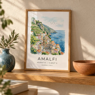 Amalfi Coast Wall Art, a small A4 framed print leaning on a honey-toned oak shelf in a living room