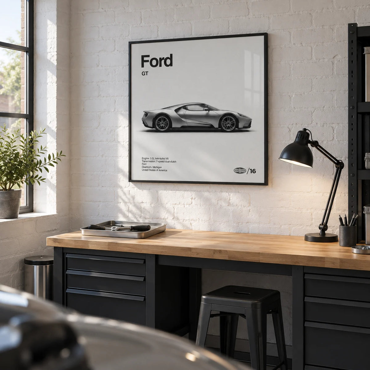 American Supercar Wall Art, framed on the wall of a clean converted garage hobby room in a UK home with a white painted brick wall and sealed concrete floor in a home office