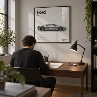 American Supercar Wall Art, framed on the wall of a compact home study for an automotive design enthusiast with a pale grey wall and oak floor