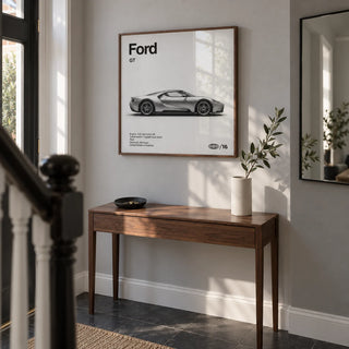 American Supercar Wall Art, framed on the wall of a contemporary hallway in a renovated UK terrace with a pale grey wall and dark tiled floor