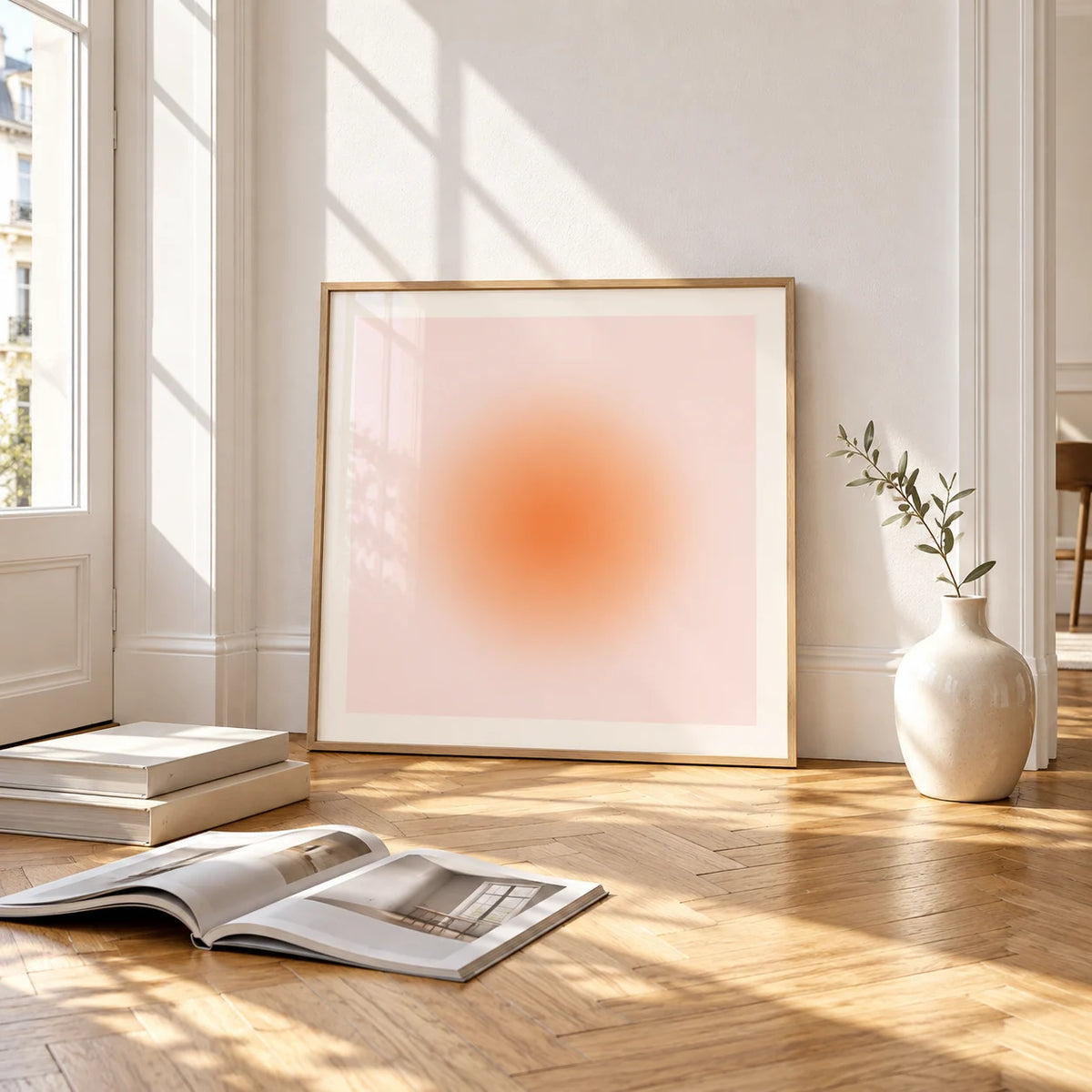 Apricot Print, framed and leaning on the parquet floor of a bright living room
