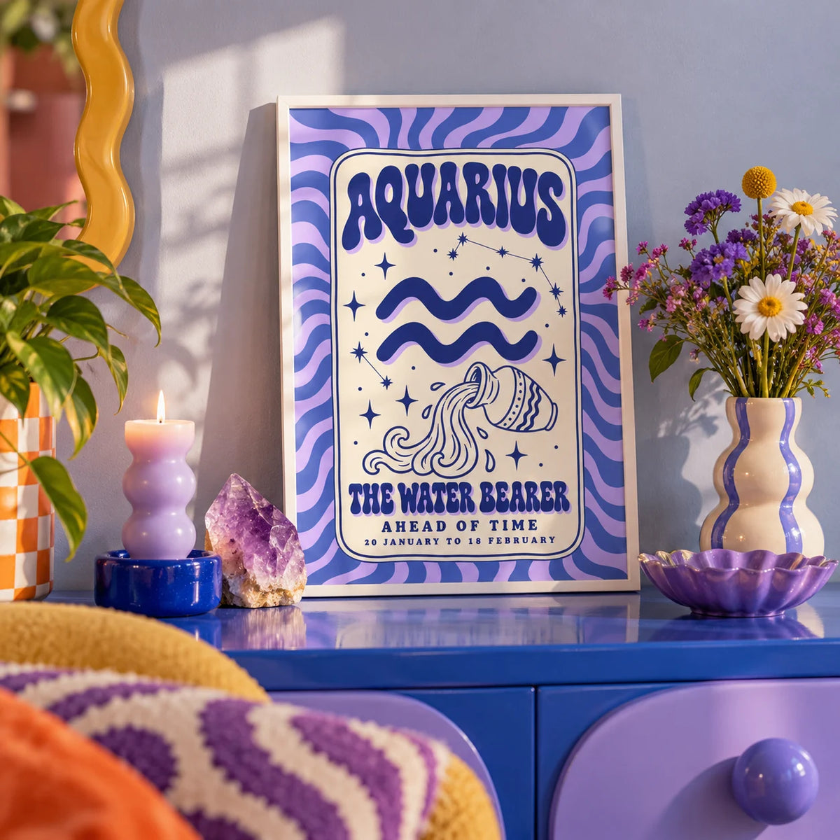 Aquarius Print, a small A4 framed print leaning on a colourful lacquered shelf in a living room