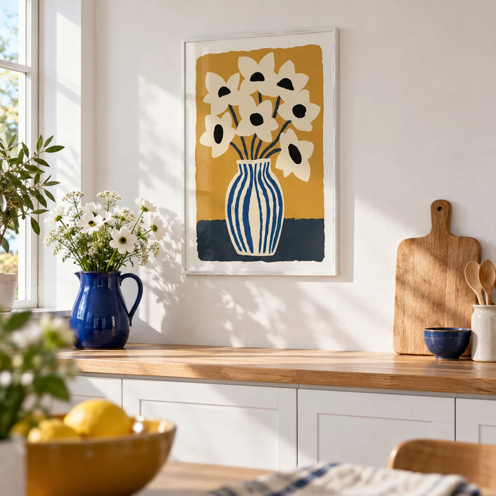 Art Print Flowers, framed on the wall of a bright kitchen with plain white cabinets