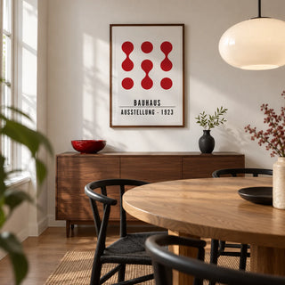 Artwork for Office Walls, framed on the wall of a compact modern dining room in a UK terraced home with a white wall and a round oak dining table