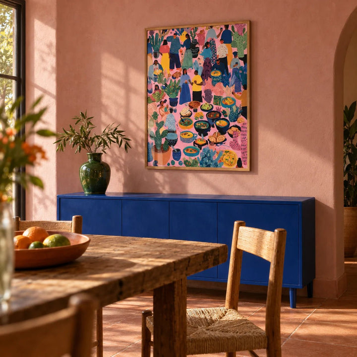 Artwork from Mexico, framed on the wall of a warm Mexican-modern dining room