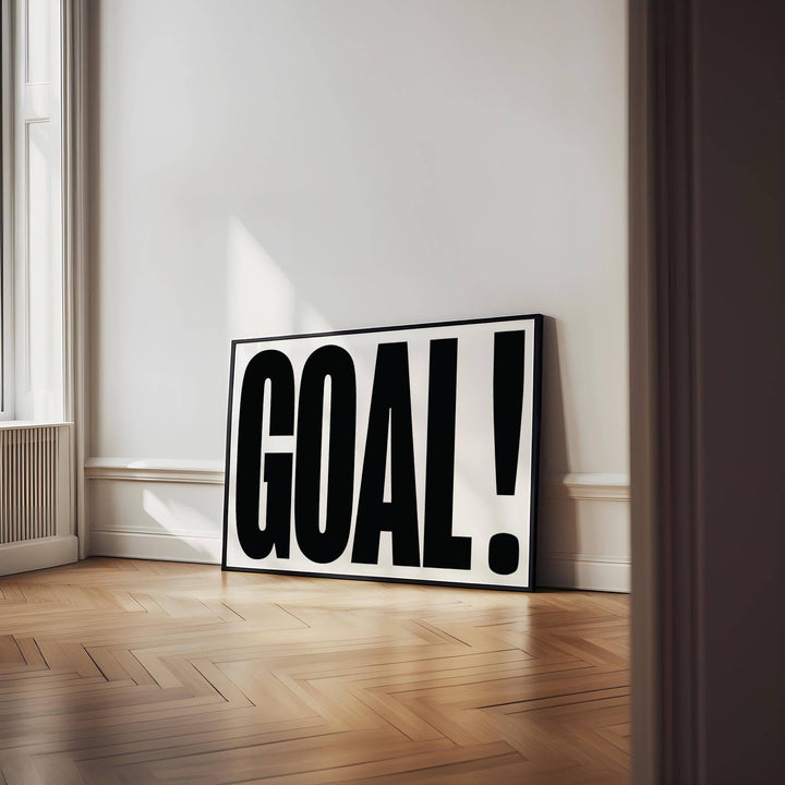 Wall Art for Games Room leaning print with typography word GOAL in black and white on wooden floor