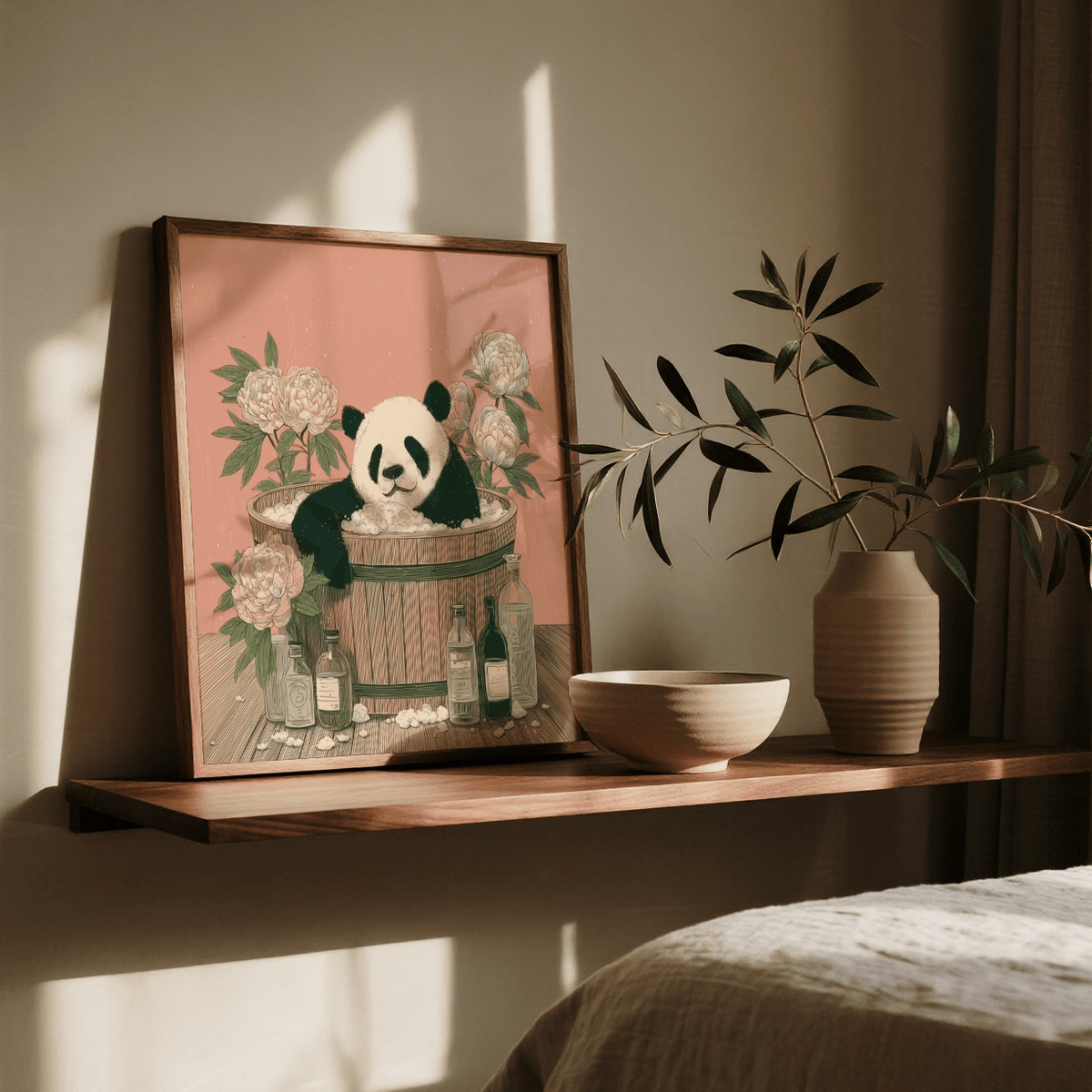 Print leaning on a shelf with Panda Bath Print of a panda in a wooden tub in pink and green tones with a vase
