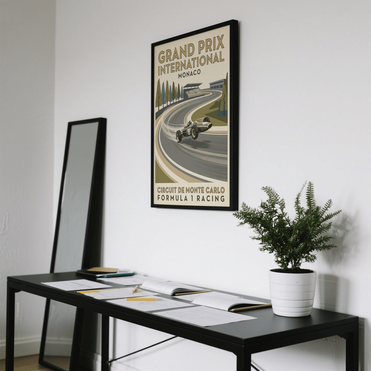 Vintage Open Wheel Racing Print on wall above desk with plant in a minimalist room