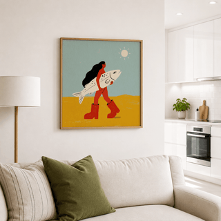 Woman Carrying Fish Print on wall in living room above sofa with cushions and floor lamp