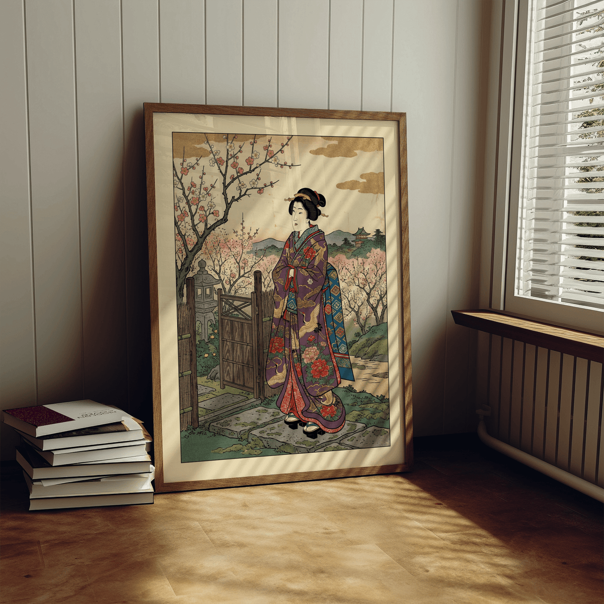 Floral Kimono wall art leaning on shelf with books nearby showing a maiko and cherry blossoms