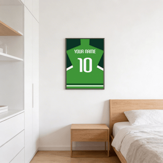 Football Shirt Poster in Green with Dark Green Sleeves above a wooden bedside table in a bedroom