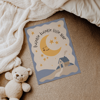 Twinkle Twinkle Star Print lying on a carpet next to a teddy bear and a knitted blanket
