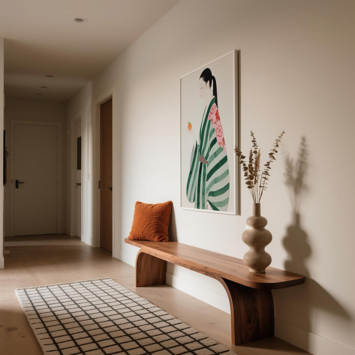 Unique wall art for living room displayed above wooden bench with orange cushion and decorative vase