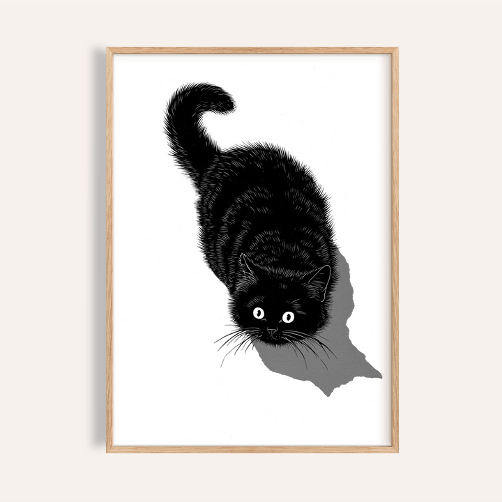 Framed Black Cat Print illustration of a black cat looking up with a curled tail on a white background