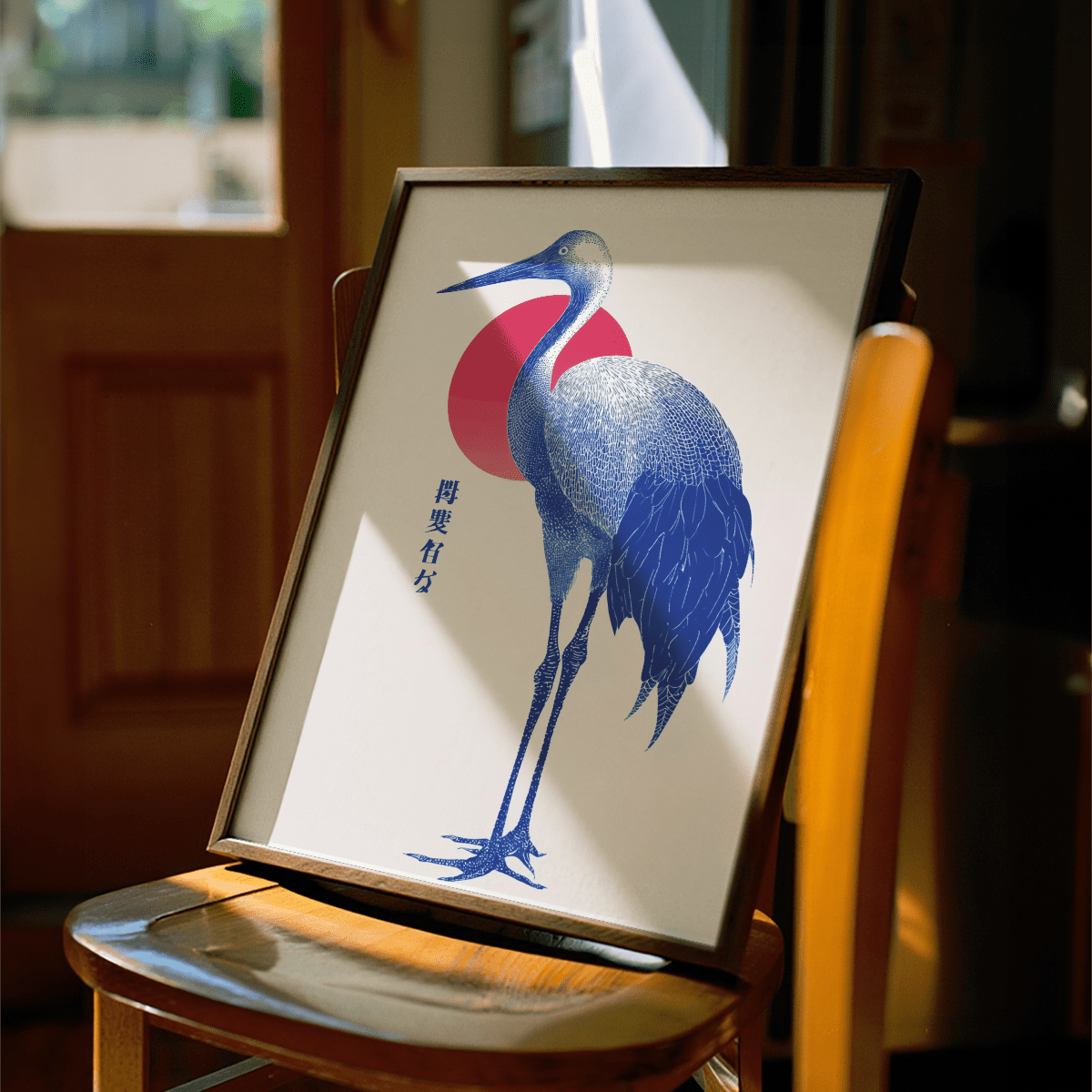 Blue Crane Art framed print close-up showing a minimalist blue crane illustration with a red circle on a chair