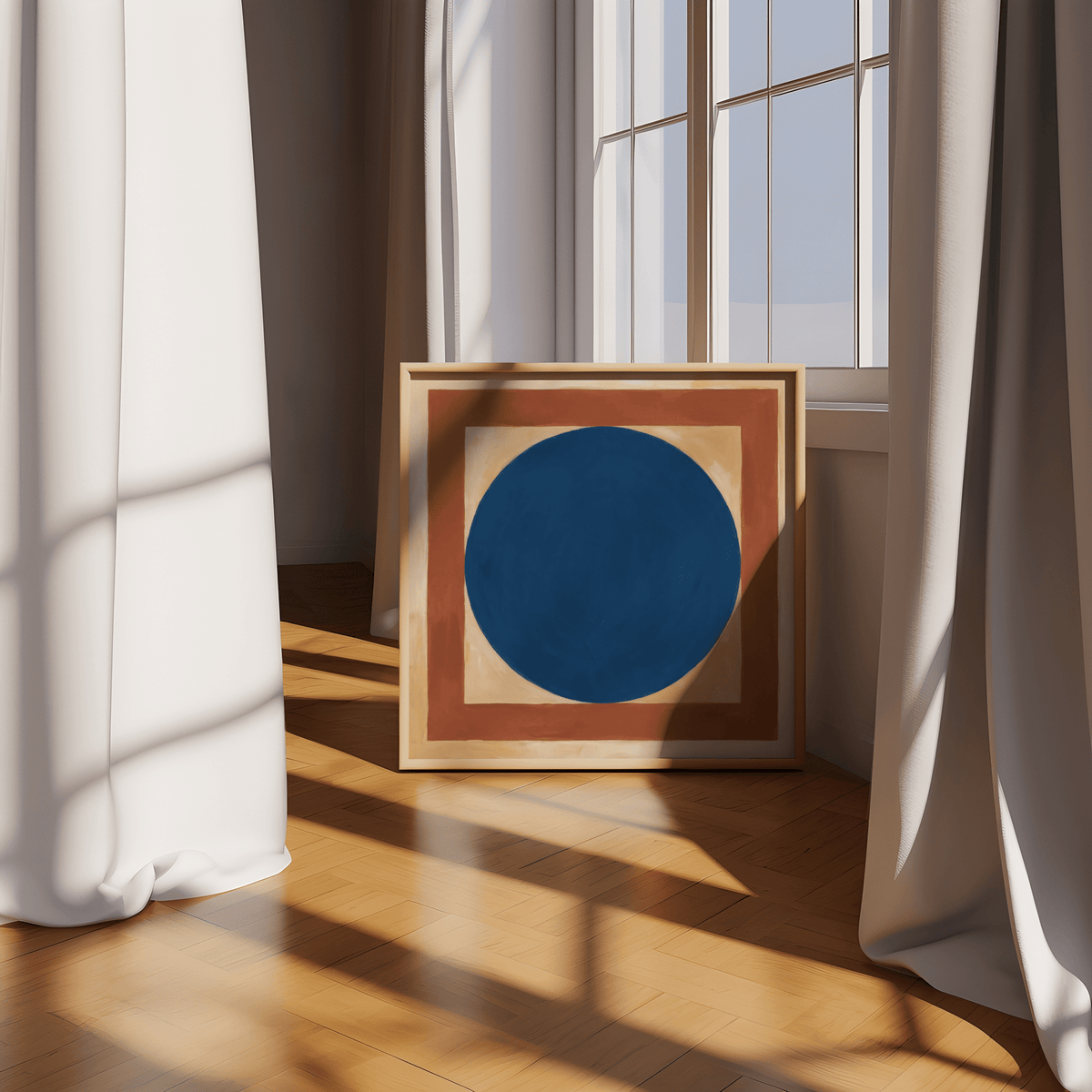 Minimalist Circle Art print leaning on a wooden floor by a window with cream curtains