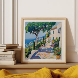 Prints of Amalfi Coast framed print of a Mediterranean path with houses and trees displayed on a shelf near books