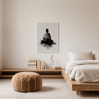 Spiritual Poster with black meditating Buddha silhouette in grey tones above books in a neutral bedroom