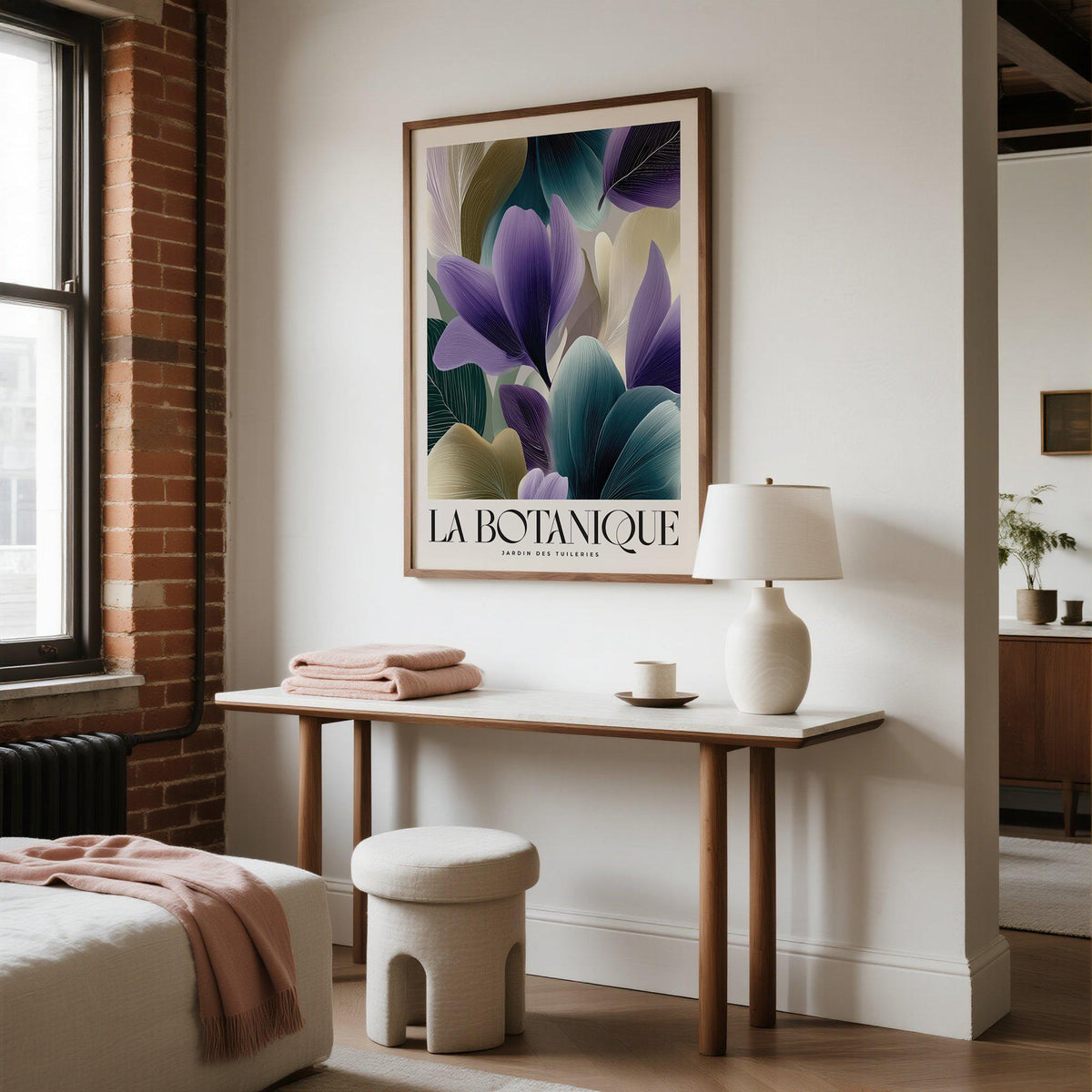 Plant poster with violet flower petals in shades of purple and green above a wooden console table with a white lamp