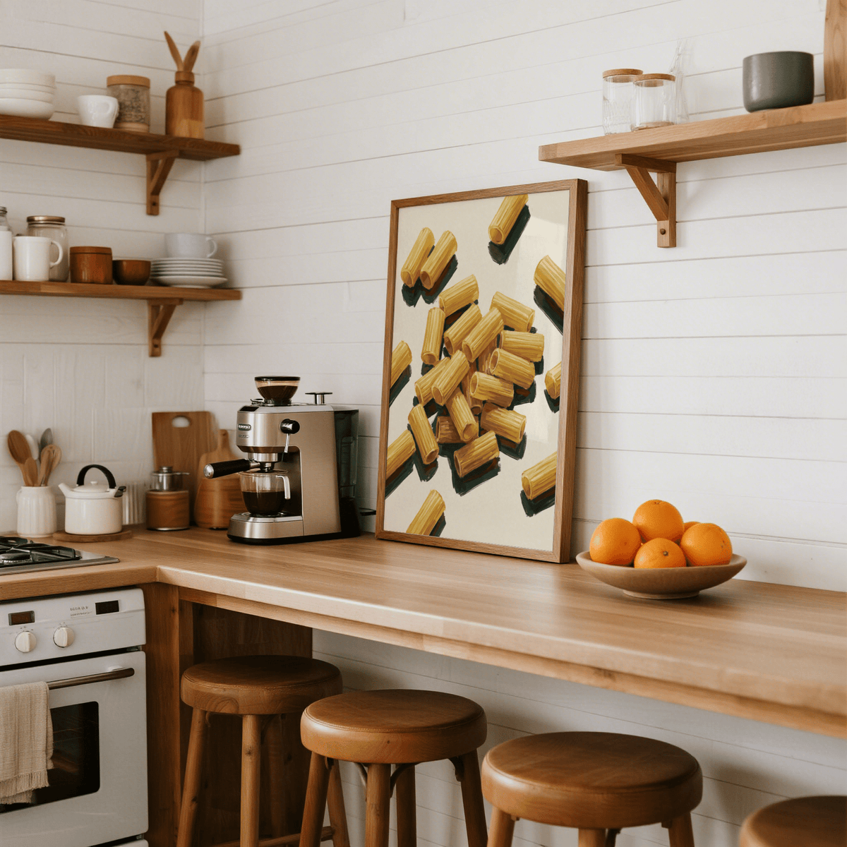 Print leaning on a kitchen surface with rigatoni pasta illustration in warm tones and wooden stools