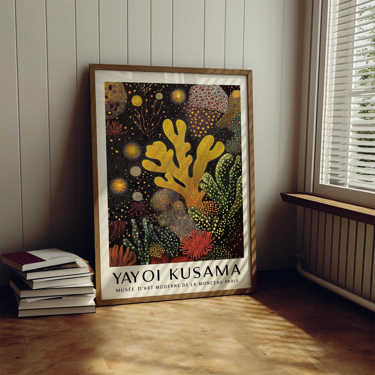 Coral Reef Painting print leaning on floor with books nearby and soft window light