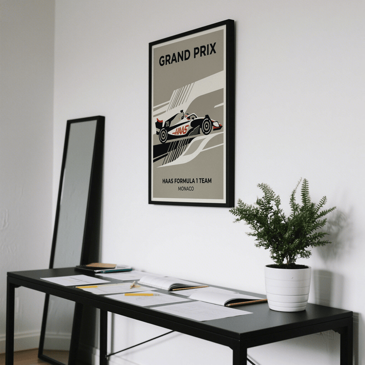 Close-up of graphic racing poster with side-profile race car and sweeping black white grey and red bands