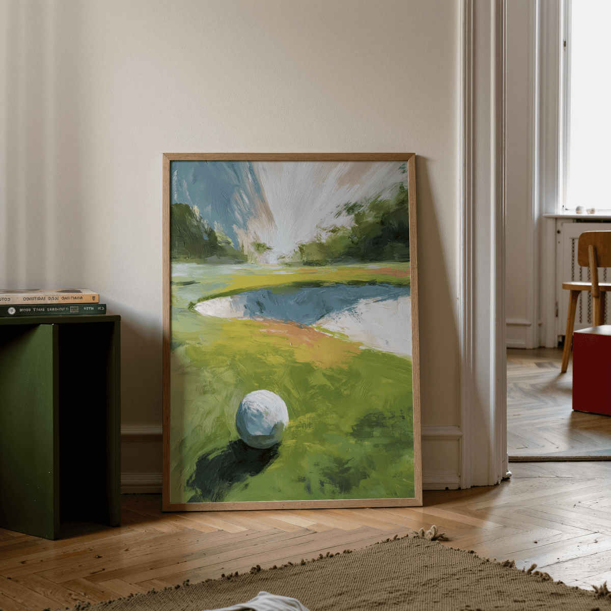 Golf Landscape wall art leaning on the floor with green and blue abstract watercolour hues near a green side table